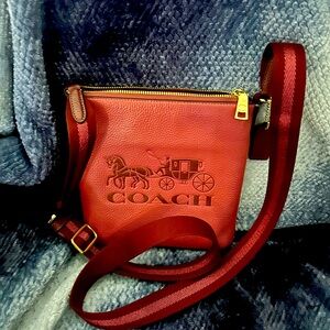 Coach Red and Pink Crossbody Bag. It’s perfect for popping in and around town.
